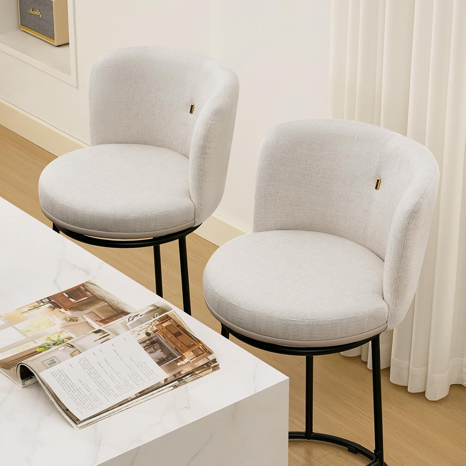 Three Beige Fabric Swivel Counter Stools